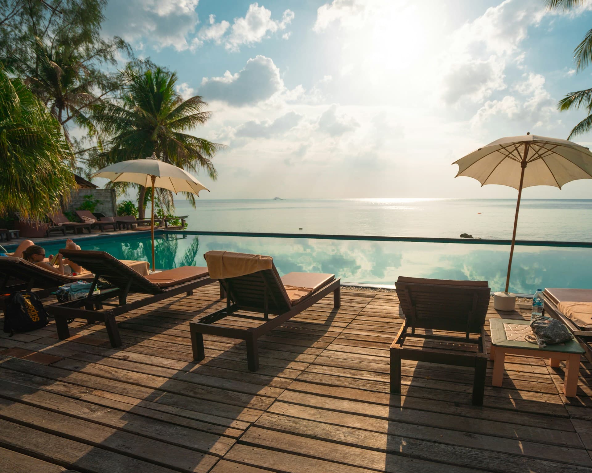 Luxury beachfront resort with palm trees and turquoise water